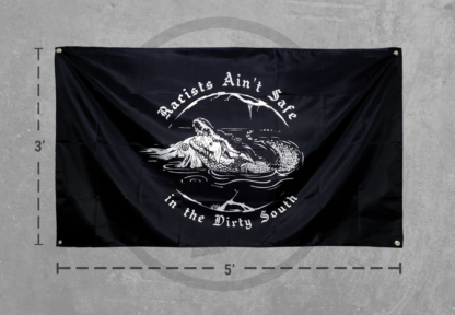 Large black flag depicting a gator eating a klu klux clan member.
